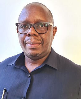 Mr. Peter Kibuda Shija - Minister Plenipotentiary